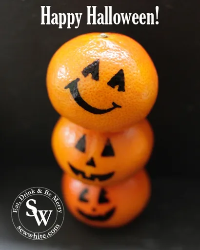 Meriendas saludables de Halloween con naranjas como calabazas