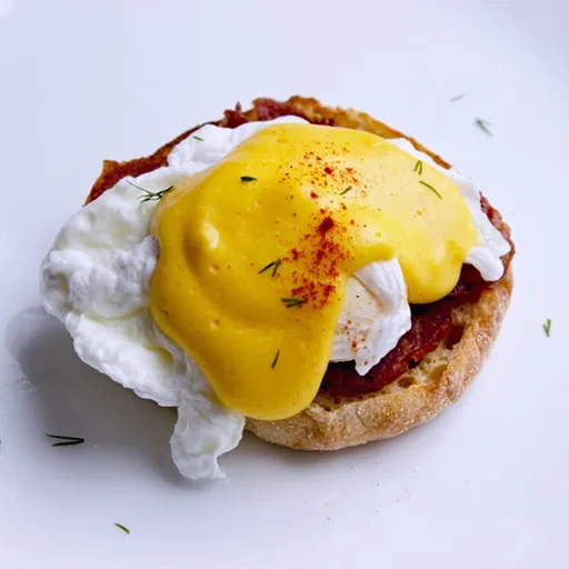 Poached eggs with paprika and hollandaise sauce (Sip Bite Go)
