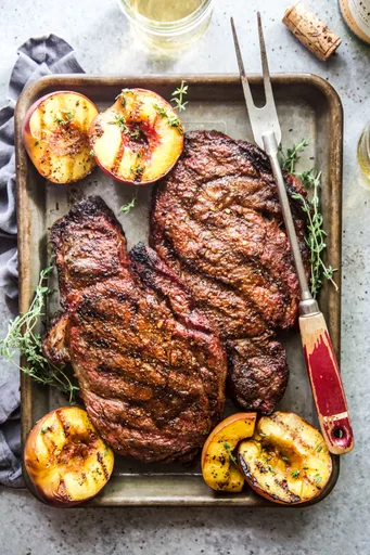 Grilled Ribeye Steaks with Peaches