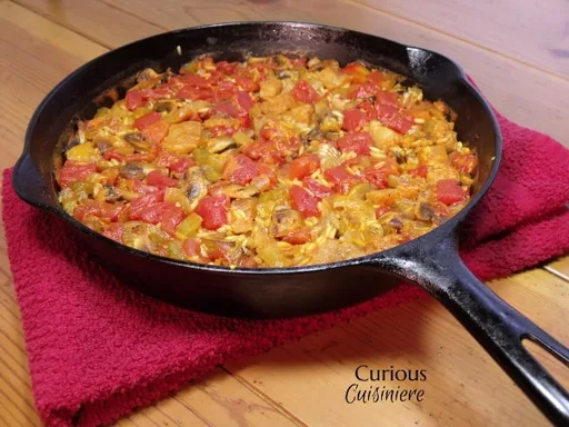 Paella de champiñones y pescado blanco