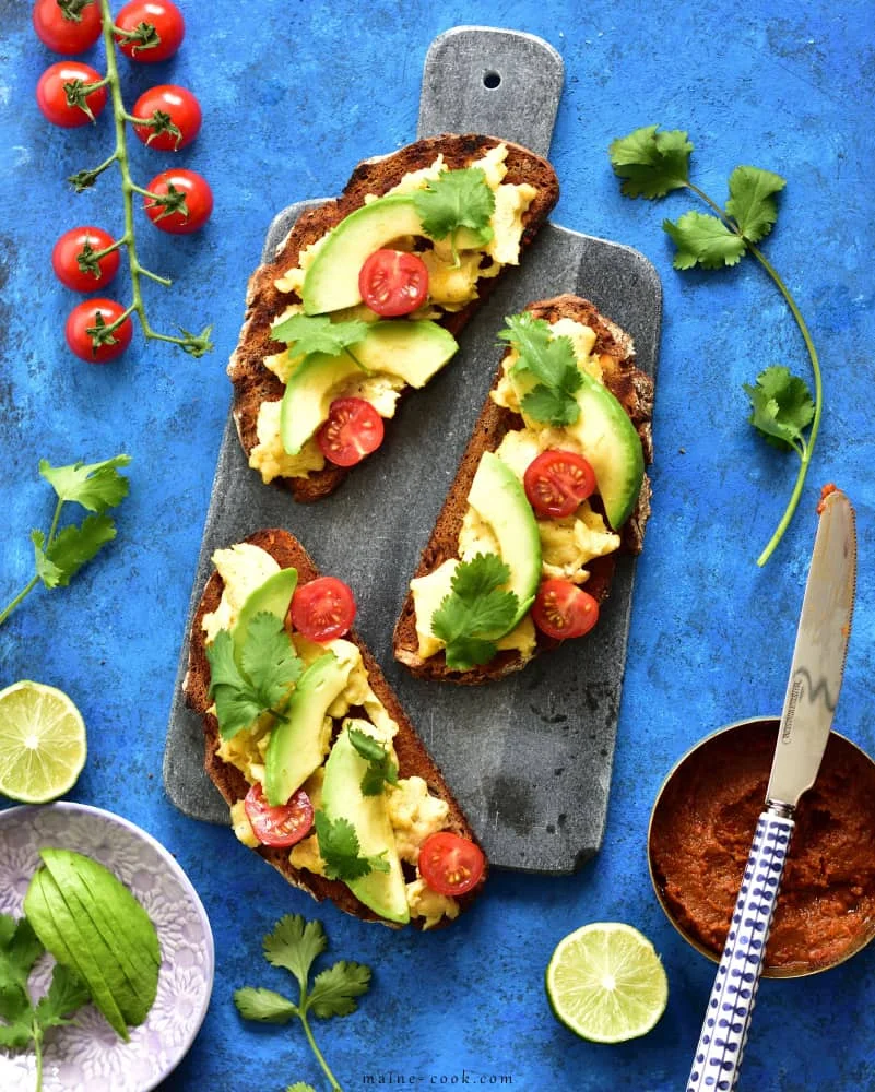 Harissa, scrambled eggs, avocado, and coriander sourdough toast