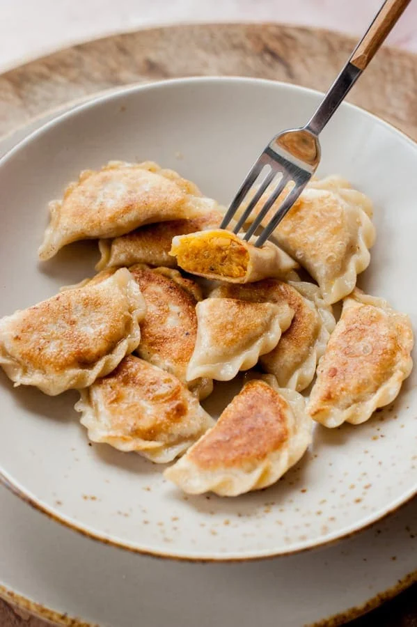 Vegan pierogi with spicy red lentil and sun-dried tomato filling