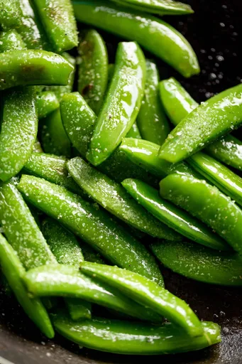 Guisantes dulces salteados a la mantequilla