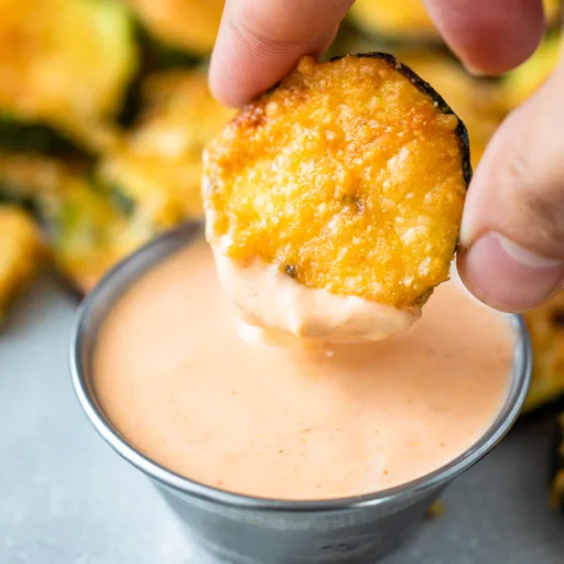 Rodajas de calabacín con parmesano en freidora de aire