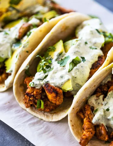 Spicy Chicken and Avocado tacos with Creamy Cilantro Lime Sauce