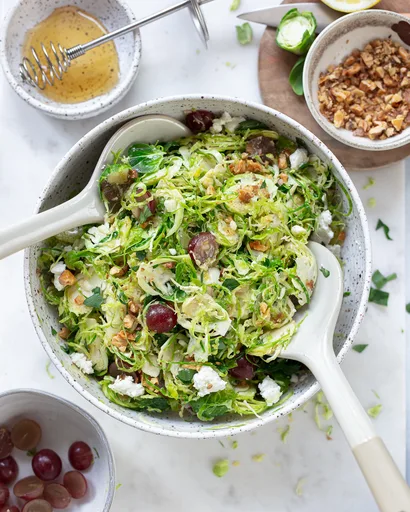 Shaved Brussels Sprouts Salad with Grapes and Goat Cheese