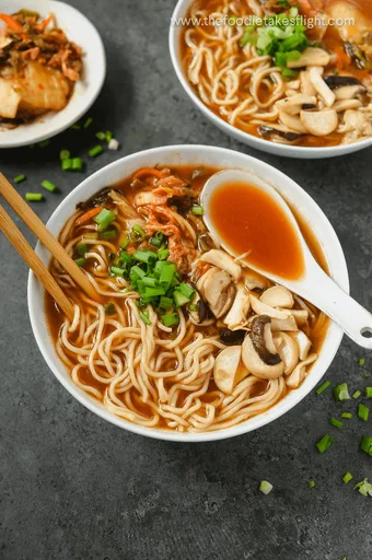 Kimchi Noodle Soup with Dumplings