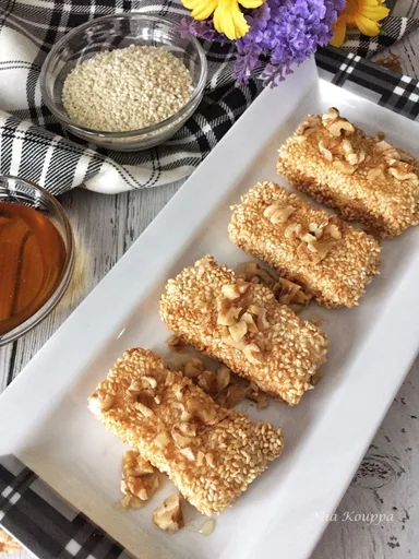 Sesame coated fried feta with honey and walnuts