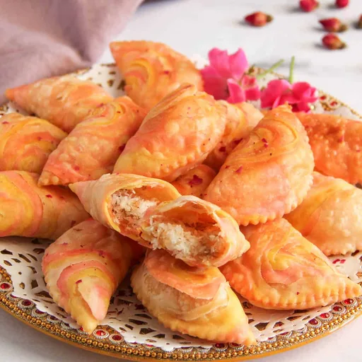 Rose Coconut Karanji {crispy pastry with sweet rose flavoured coconut filling}