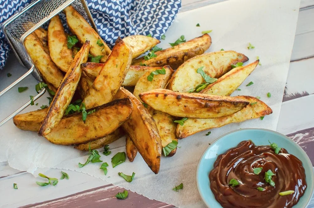 Gajos de patata especiados al curry