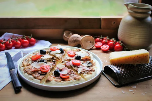 Pizza blanche à la crème de champignons et au Grana Padano