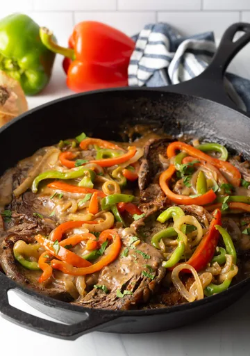 Bistec encebollado y con salsa gravy