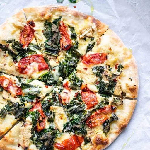 Crispy Kale, Roasted Tomato, and Vegan Chicken White Sauce Pizza