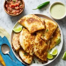 Crispy Beef Tacos with Cheddar, Pinto Beans, and Fresh Toppings Recipe