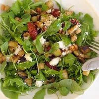 Delicious lunch: Arugula with eggplant and sun-dried tomato