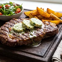 Grilled entrecôte with herb butter