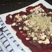 Beet carpaccio with goat cheese and raspberry dressing