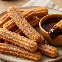 Churros with chocolate sauce from the air fryer