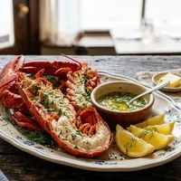 Boiled lobster with herb butter and lemon