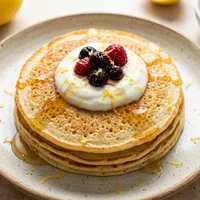 Gluten-free rice pancakes with ricotta and lemon
