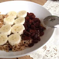 Delicious breakfast with rice, banana and walnuts