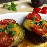 Super tasty: oven-baked avocado with egg and tomato