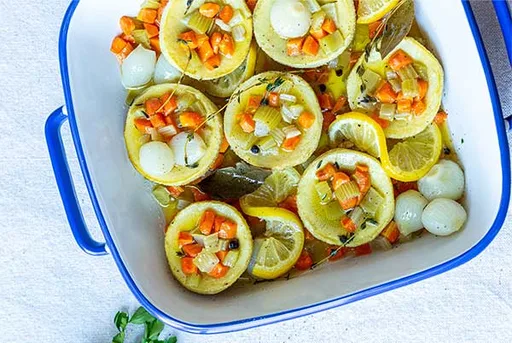 Artichokes Poached in Olive Oil with Vegetables