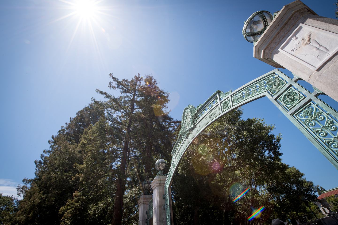 A color photo of Sather Gate beneath a sun-drenched sky.