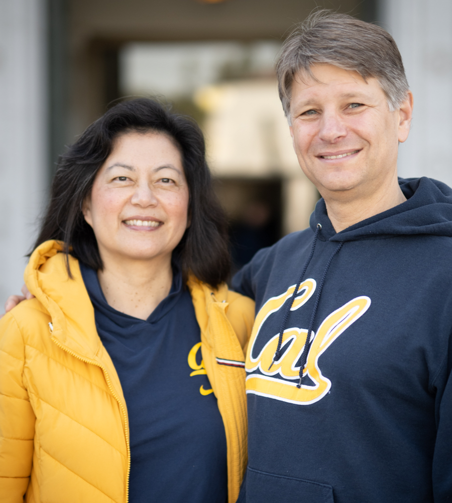Forence is wearing a blue Cal hoodie and yellow jacket, and Andrew is wearing a Cal script sweatshirt.