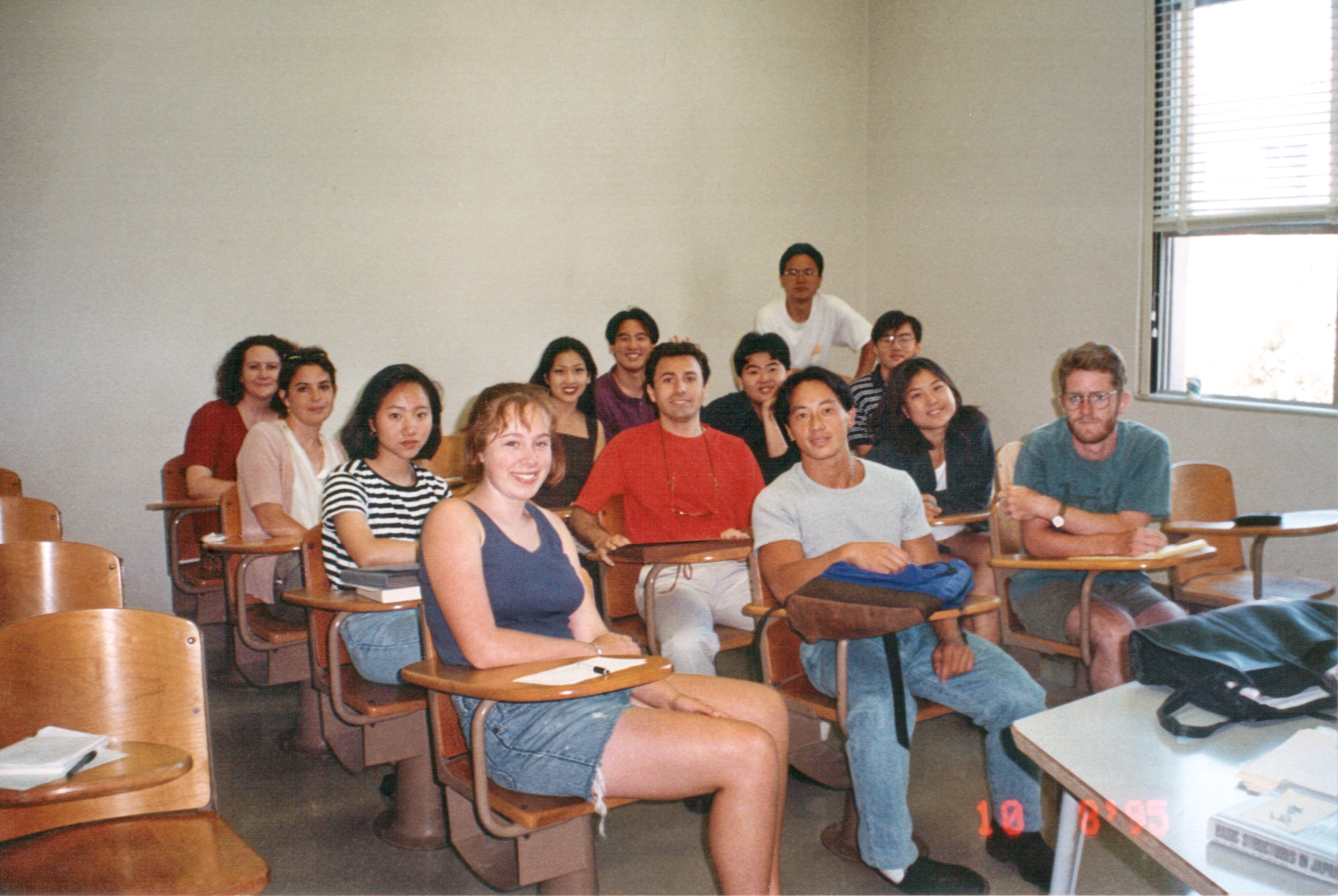 Photo of 13 students seated in chairs