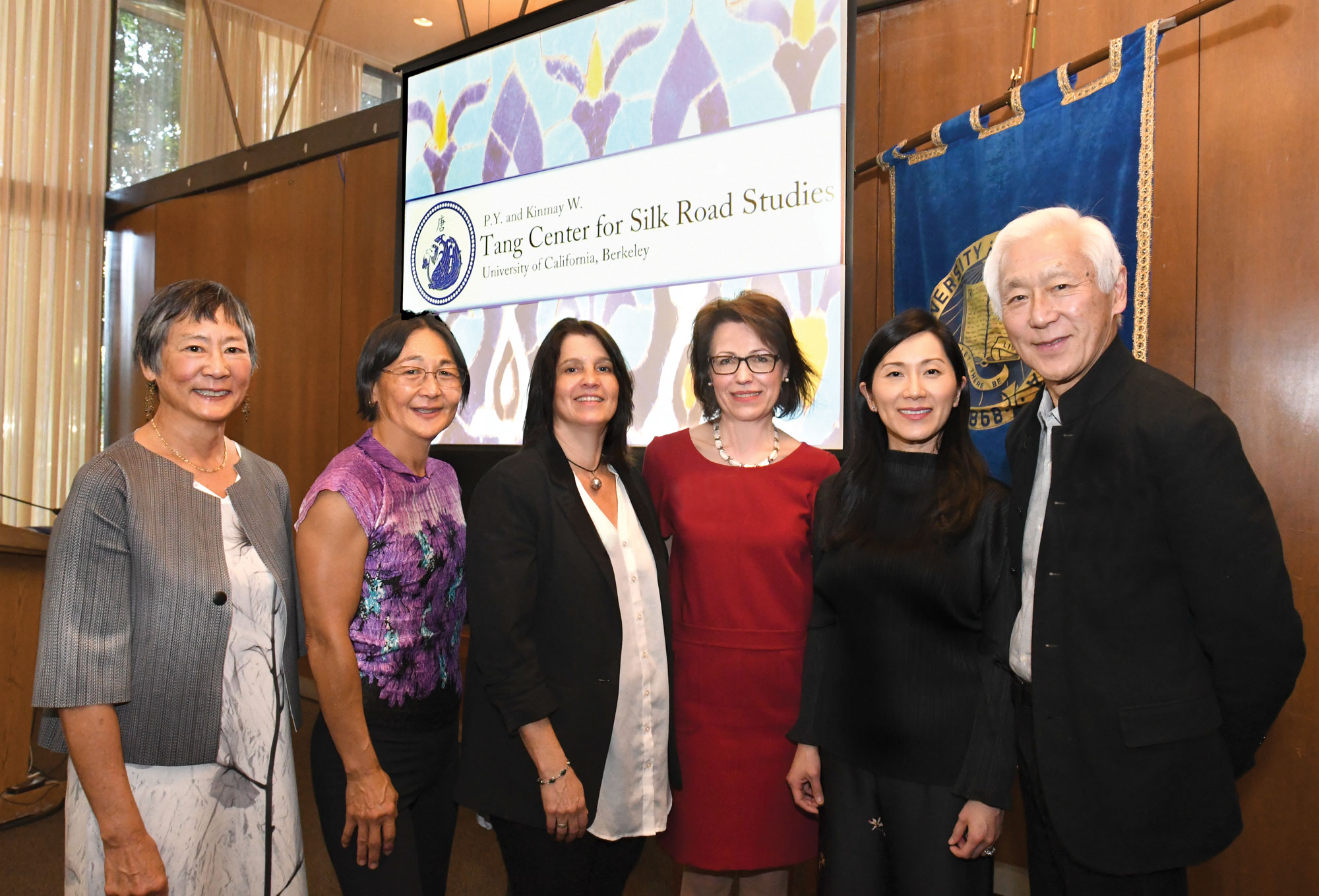 Photo of donors smiling and standing together for photo