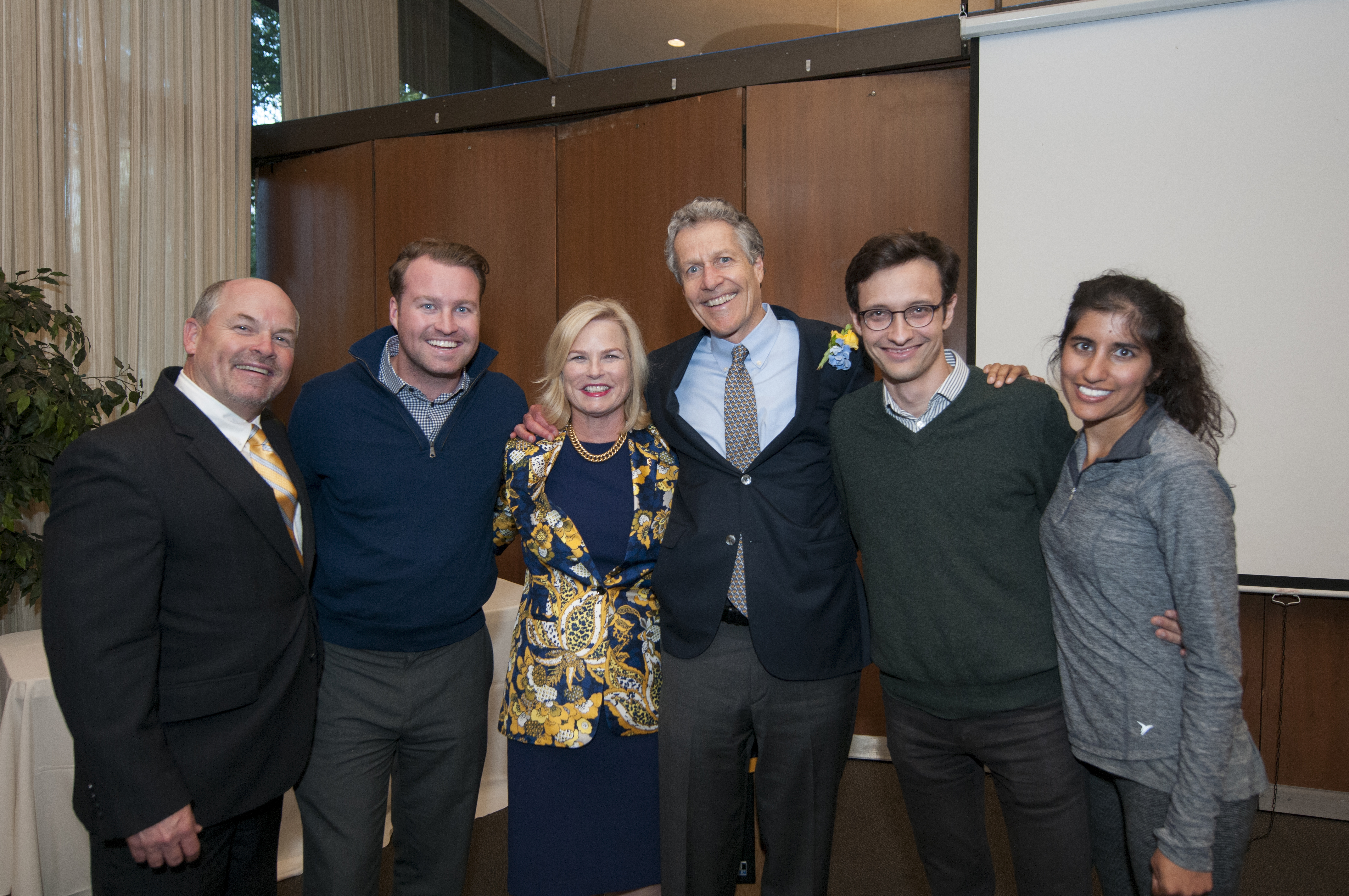 Photo of six people standing together at the Volunteer Awards.