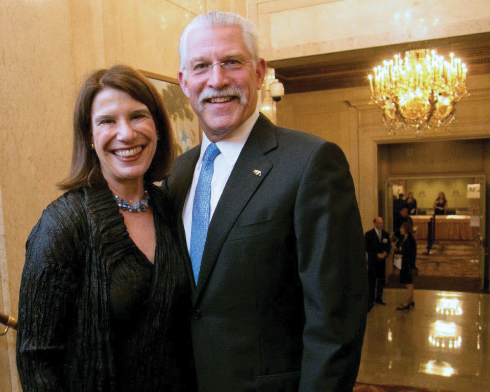 Photo of Barbara and Marc Desoer, smiling into the camera