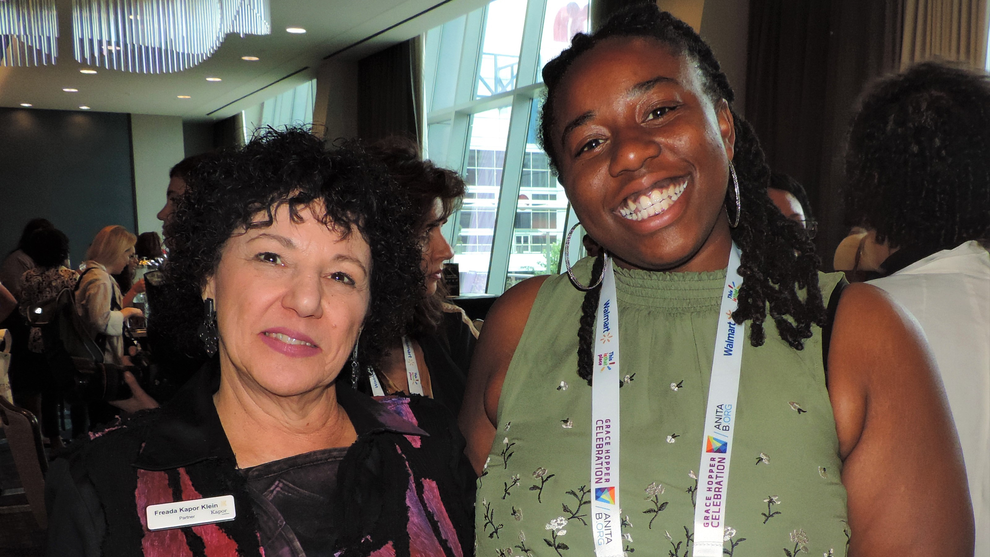 Photo Freada Kapor Klein and Haile Shavers, standing close together and smiling at the camera