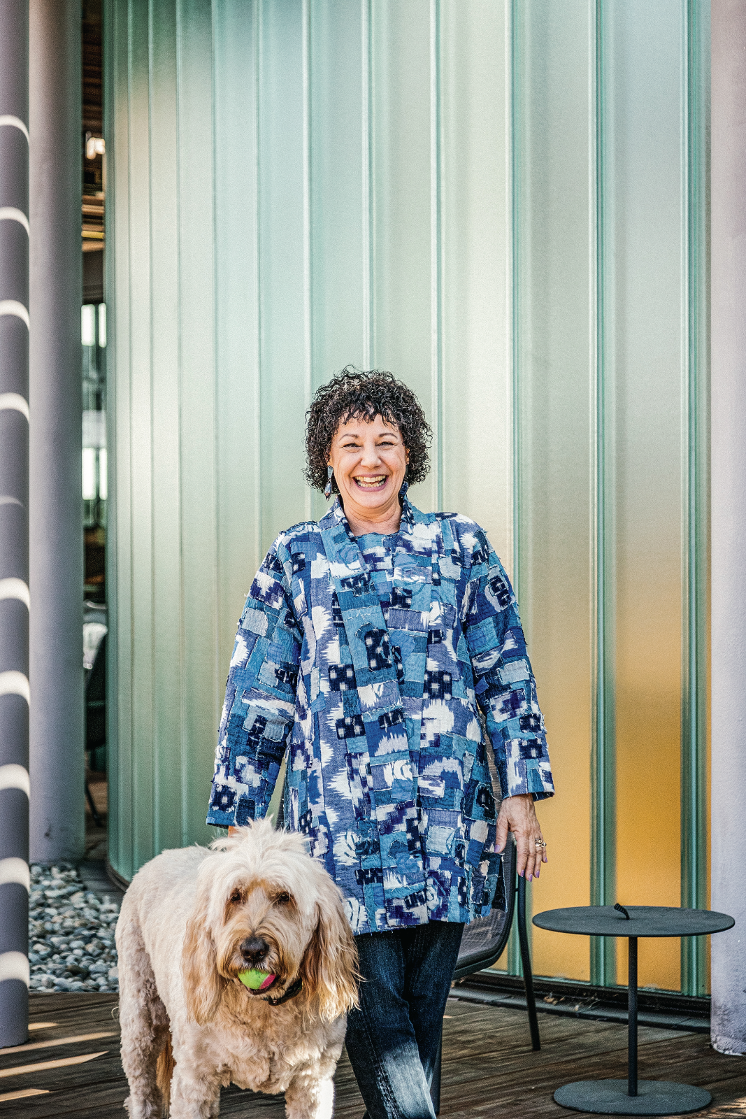 Photo of Freada in a long patterned blue jacket.