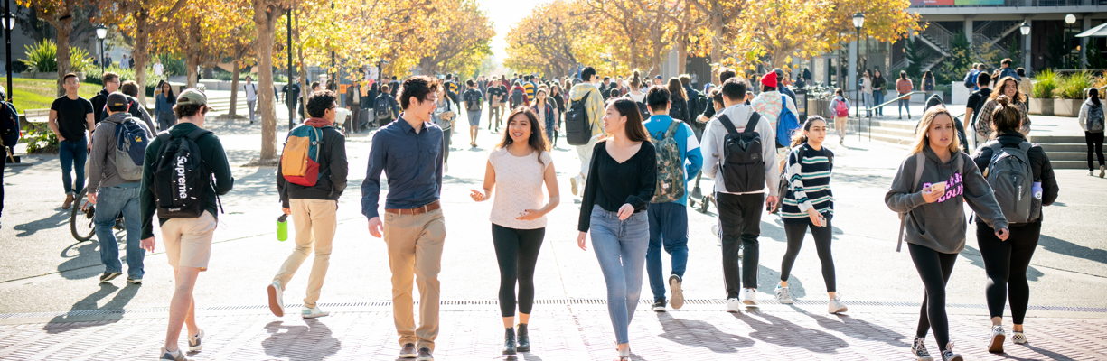 Sproul plaza with a group of students bathed in sunlight