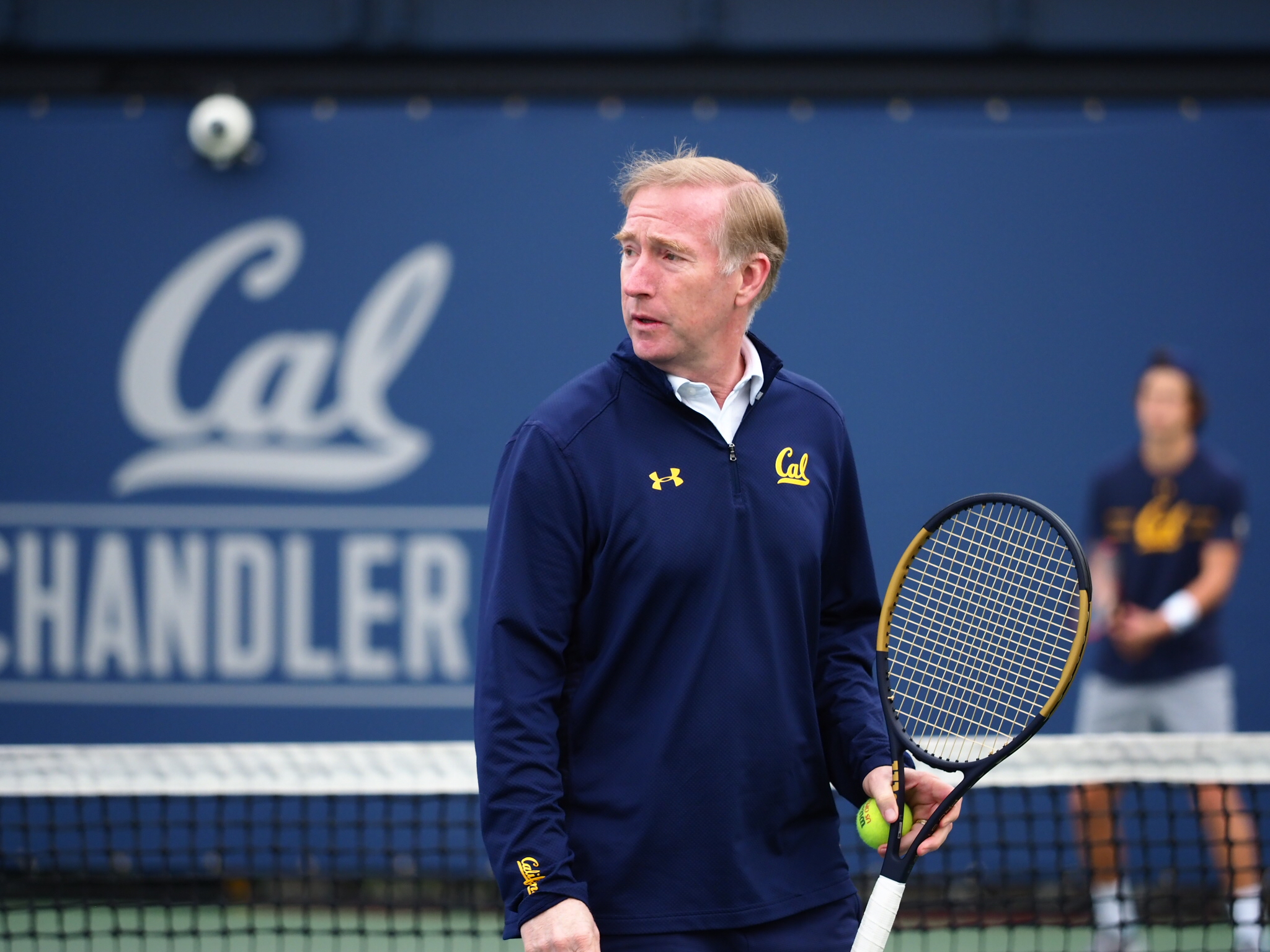 Photo of Peter Wright ’91 holding a racket on the tennis court.