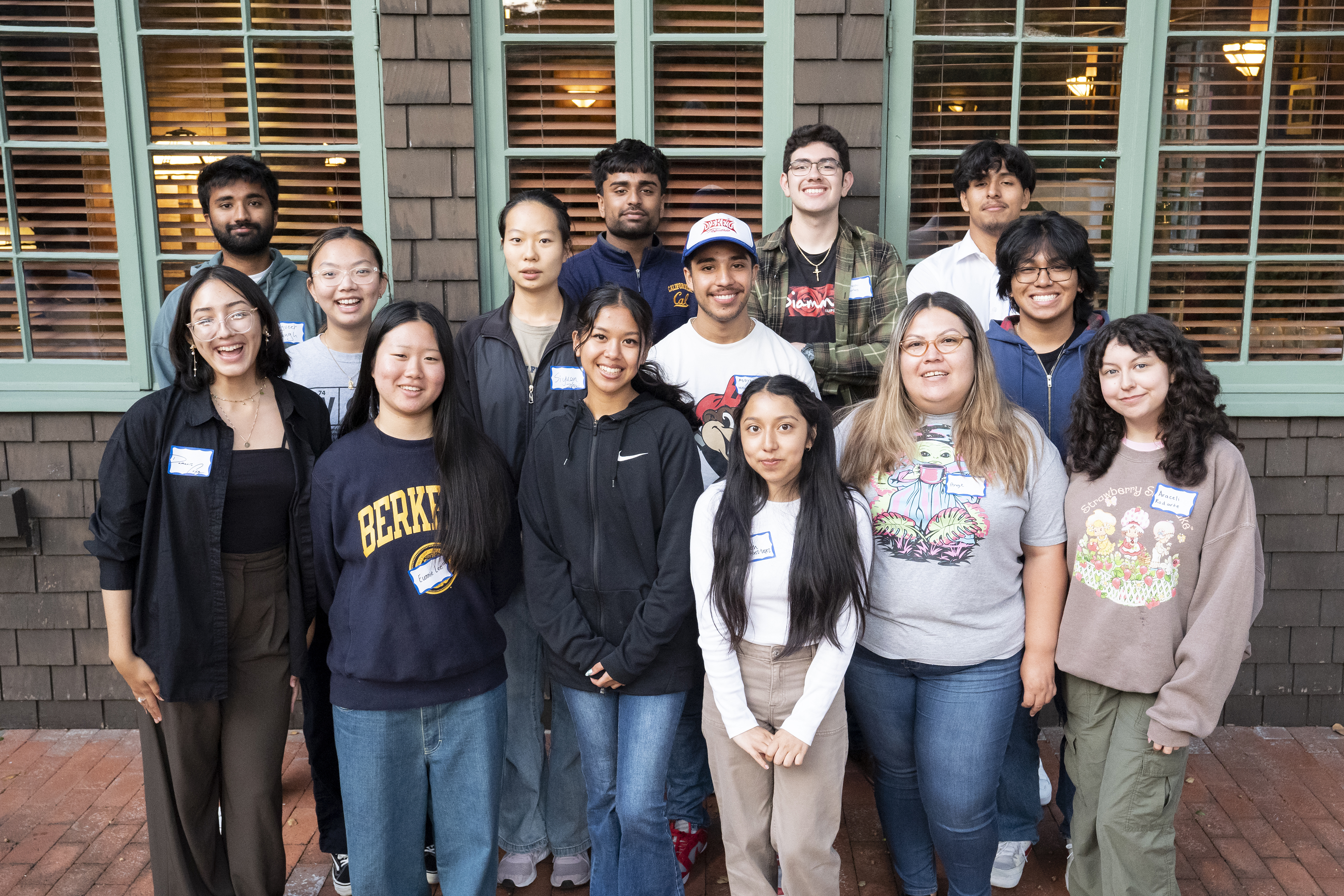 Color photo of a diverse group of 14 students