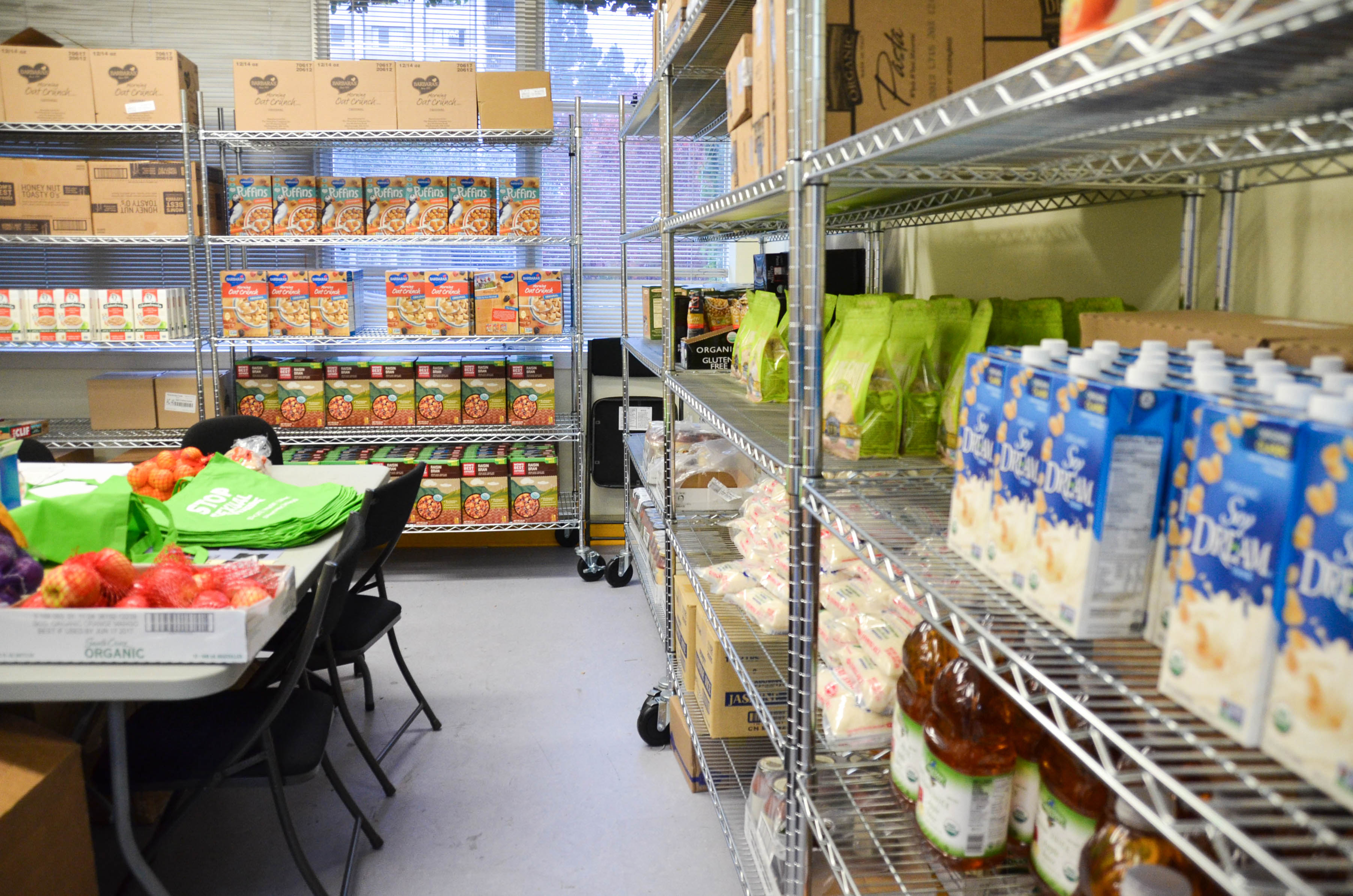 Photo of shelves stacked with food for students in need.