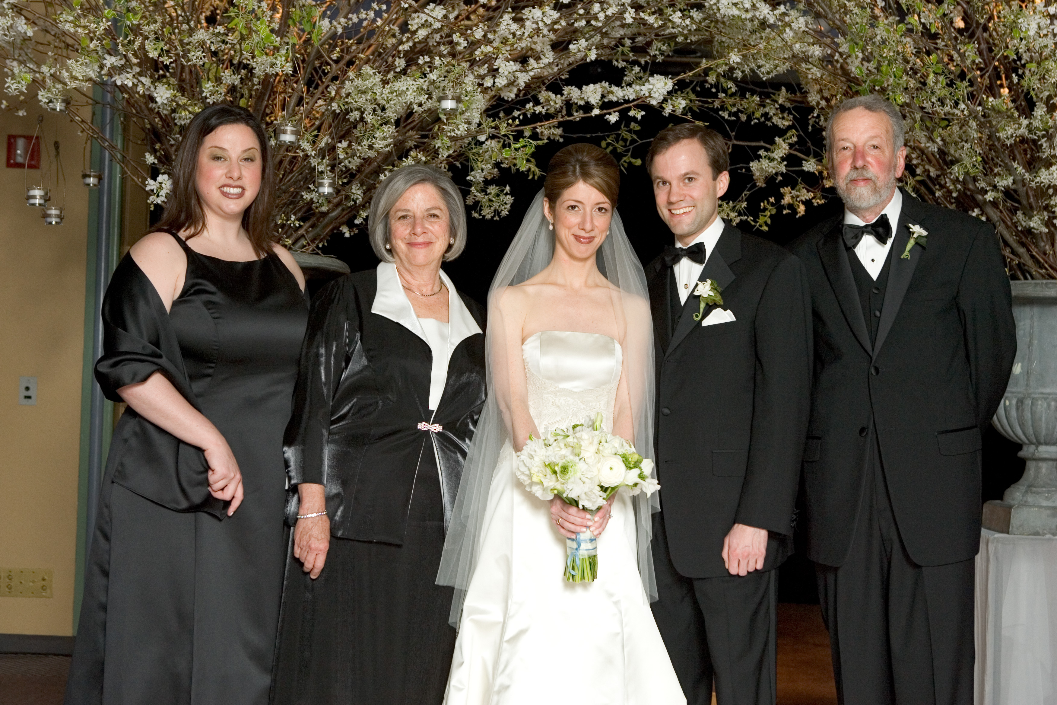 Color photo of a posed wedding party
