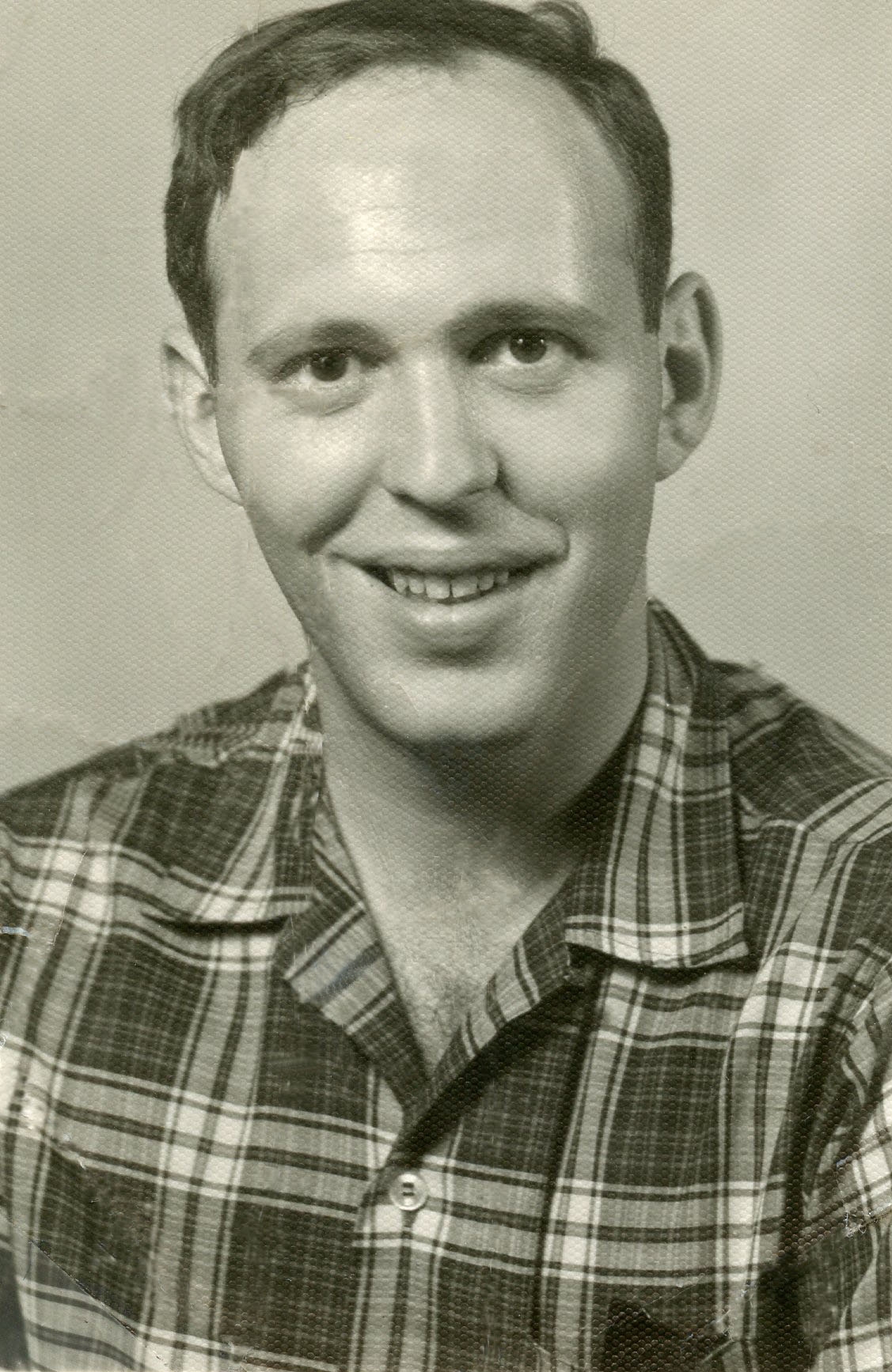 Black and white photo headshot of a young Jim Simons