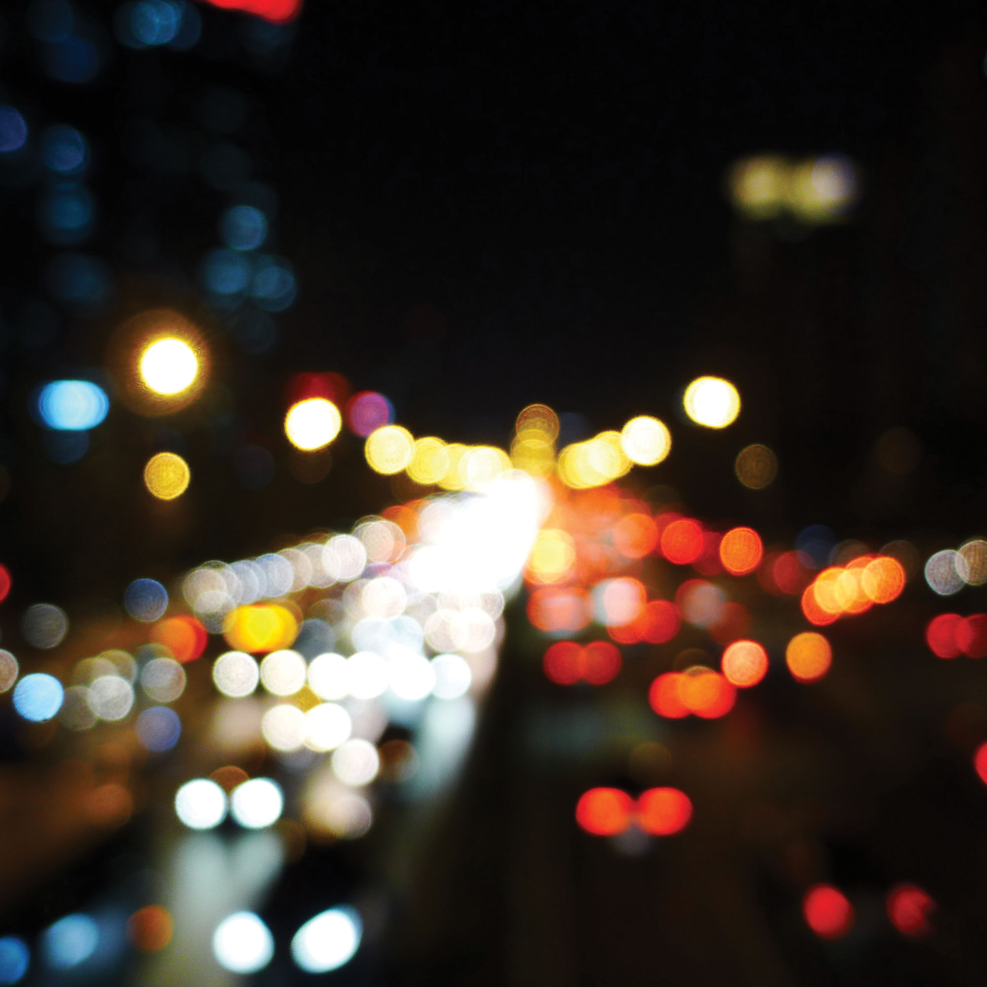 Abstract photo of blurry car lights at night.