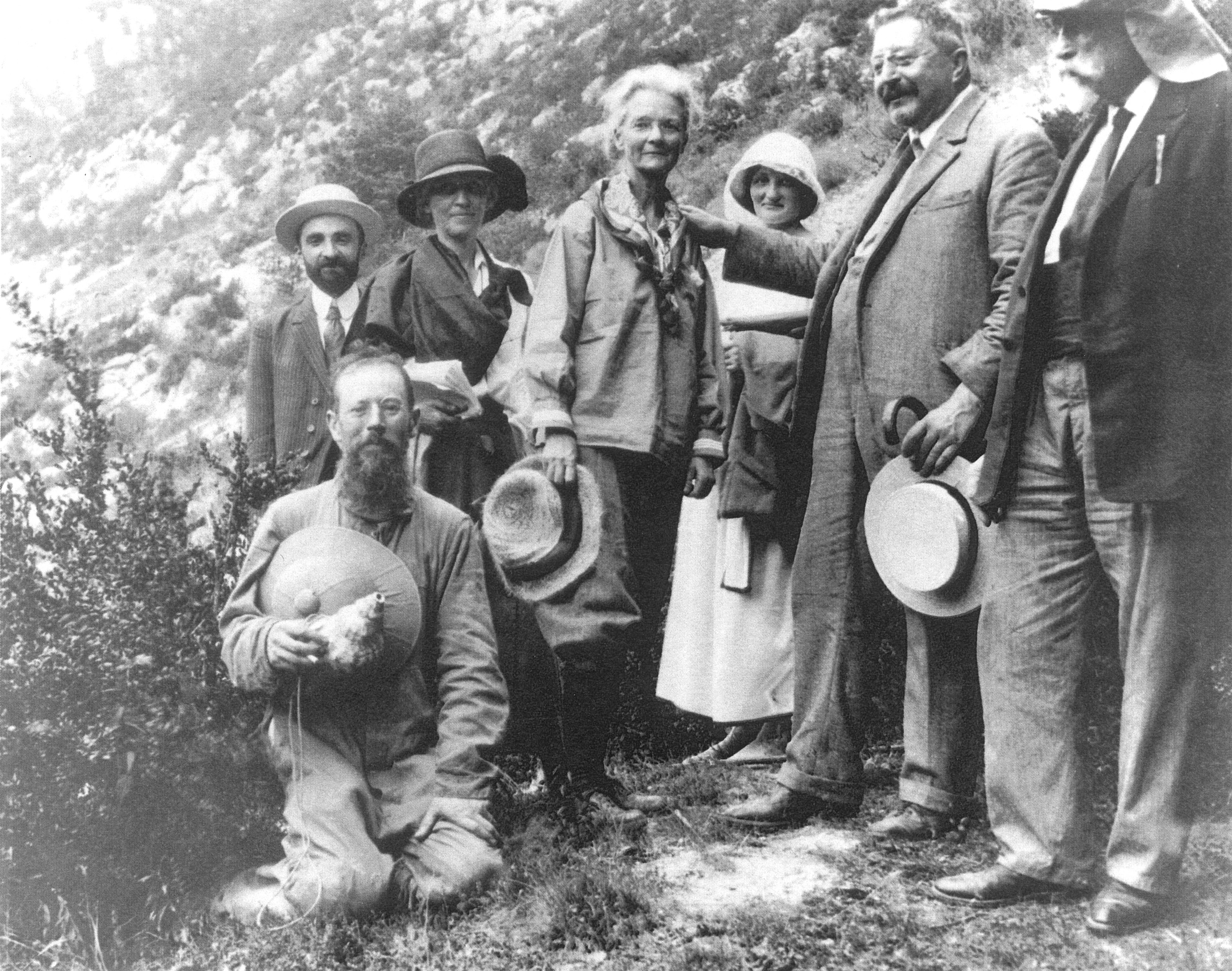 Historic photo of Annie Alexander surrounded by a group of colleagues.