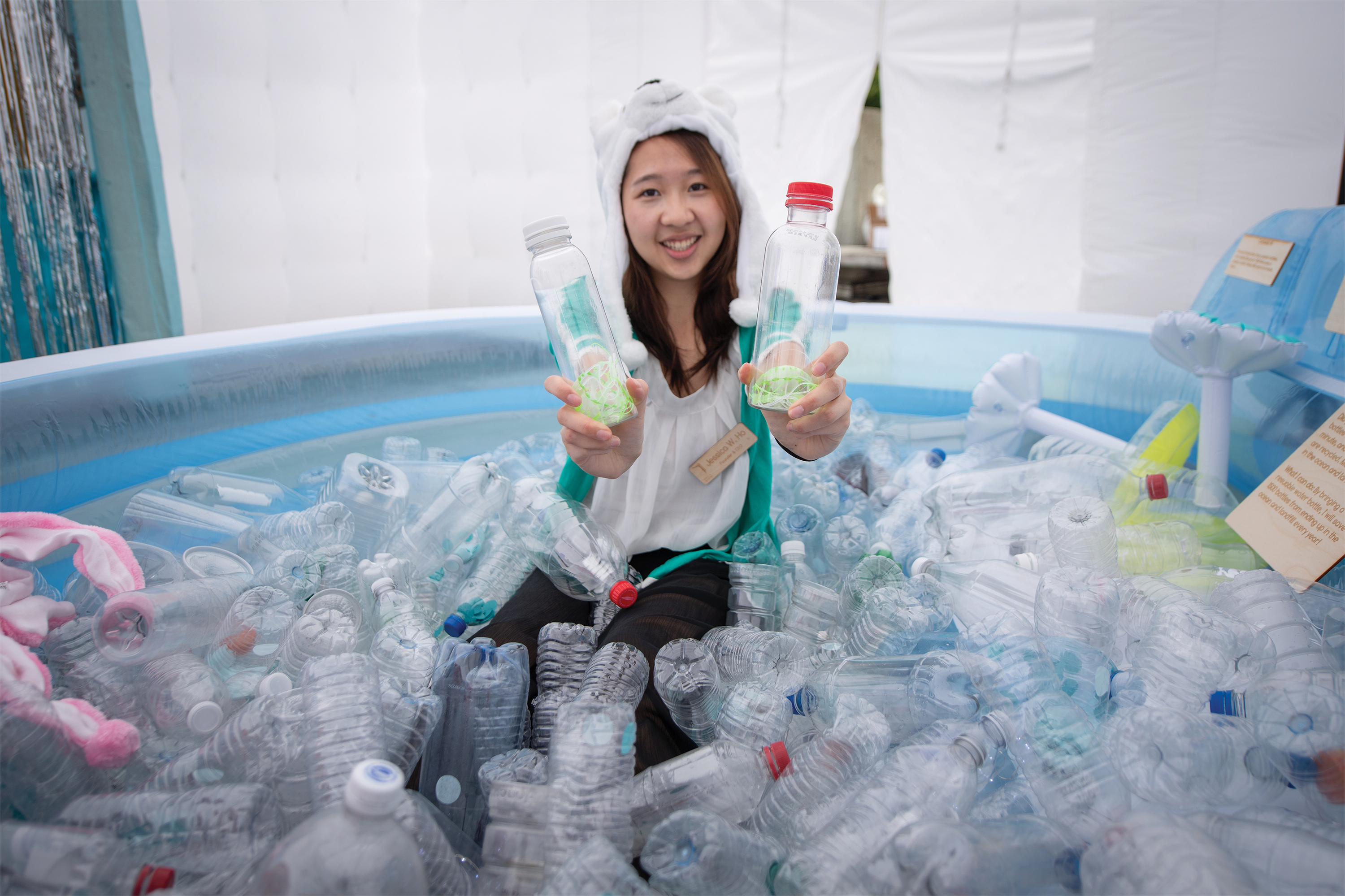 Photo of Jessica Ho M.D.P. '19 holding two bottles containing toy jellyfish.