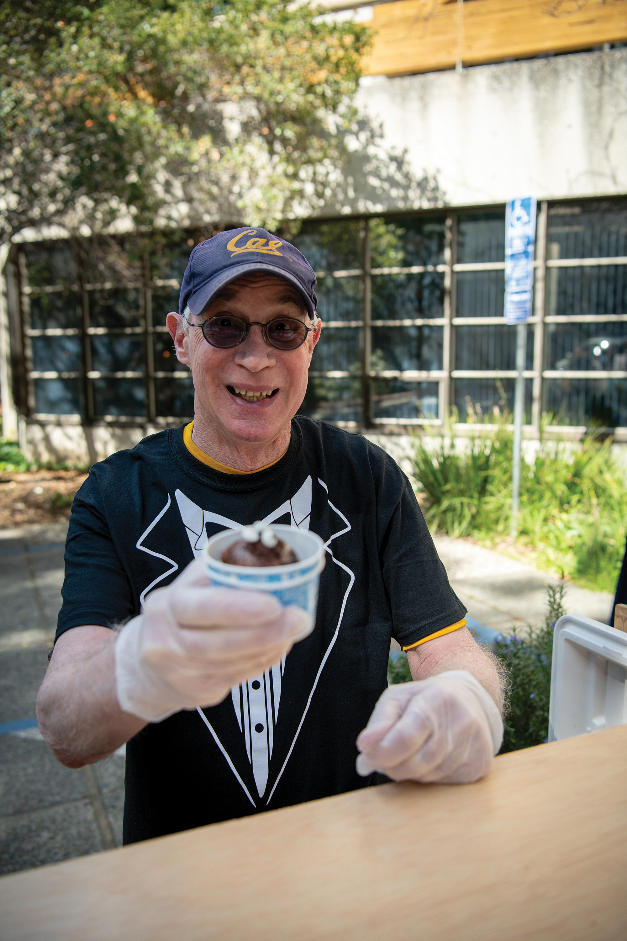 Michael G. Harris doles out ice cream with a smile.