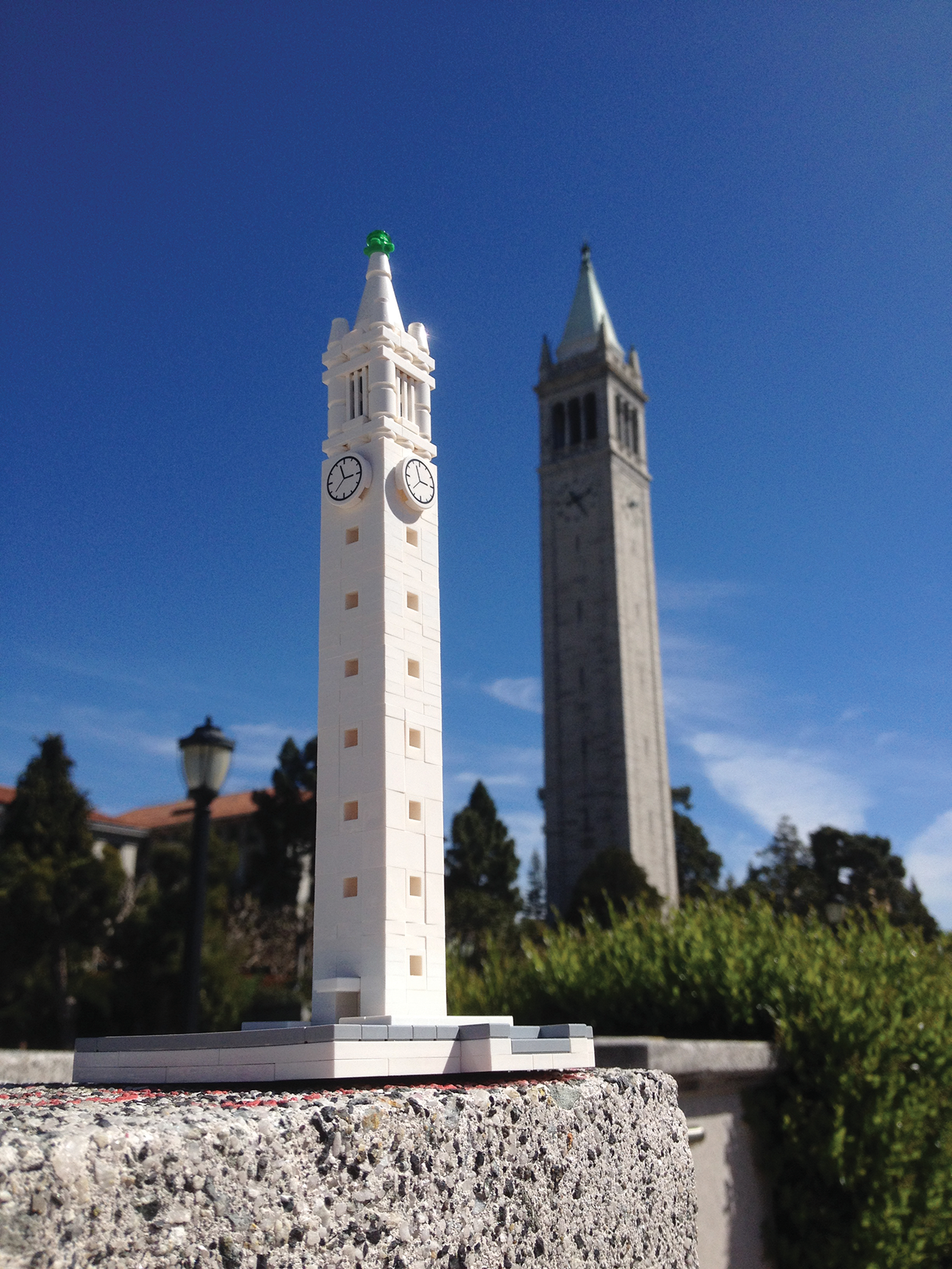 Photo of a LEGO version of the Campanile, shot in the shadow of the real thing so they look approximately the same size