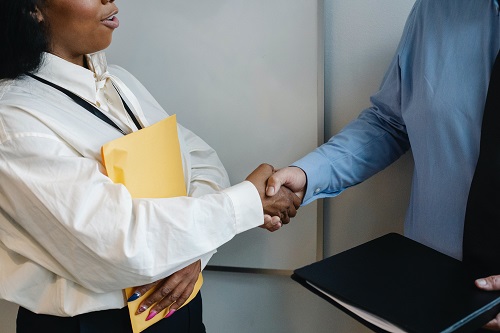 Photo of professionals shaking hands