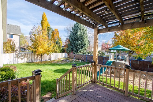 Photo of a backyard with playset