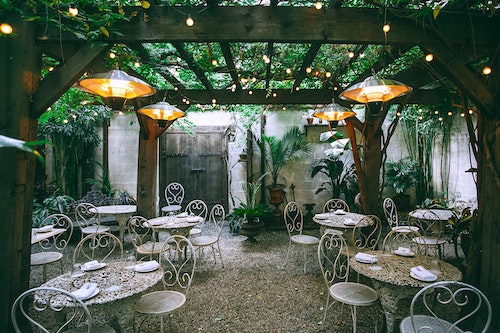 outdoor sitting space with metal chairs and tables
