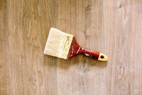home improvement projects paint brush on wood background